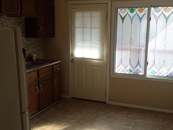 Looking out from eat in kitchen onto covered porch