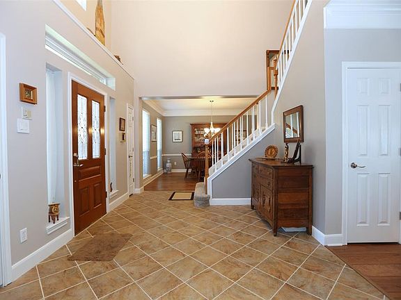 You are greeted in a 2 story foyer, with nice architectural detail above the entry. Two great storage closets as well.