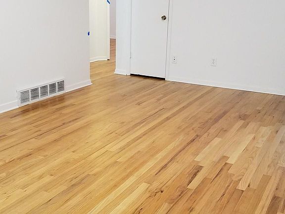 Front room looking towards hallway + 3 bedrooms & bathroom.