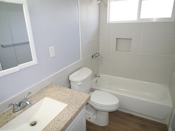 New tub and tiled walls. New flooring.