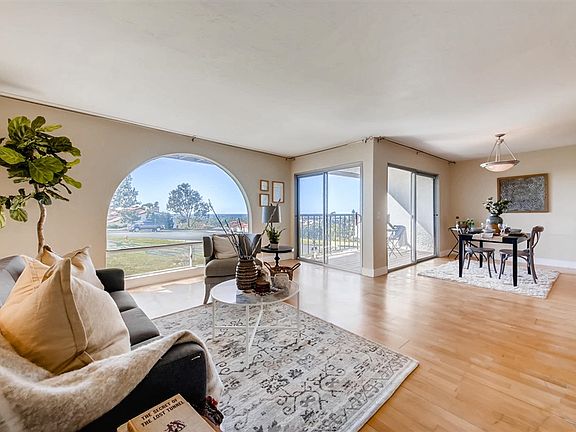 Open floor plan of Living, dining, kitchen and patio areas . (Please note this property does not come furnished)
