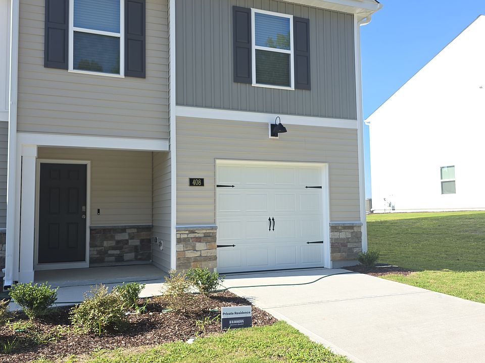 End-unit townhome with 1-car garage and driveway