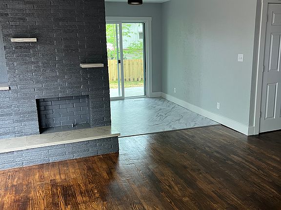 View to dining room, back patio and hallway to first floor bedroom.