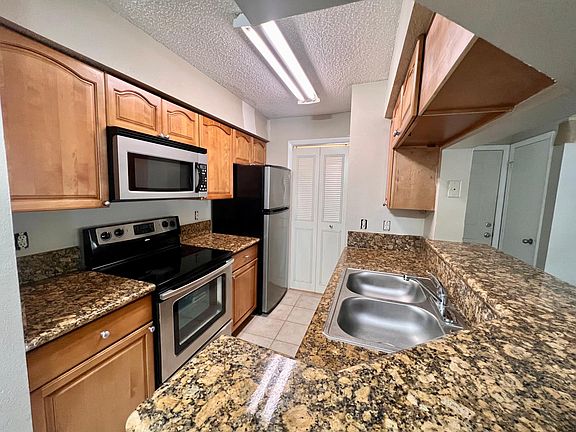 Large kitchen with granite counters