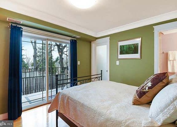 Master bedroom with balcony and walk-in closet