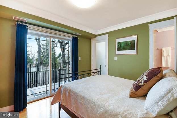 Master bedroom with balcony and walk-in closet