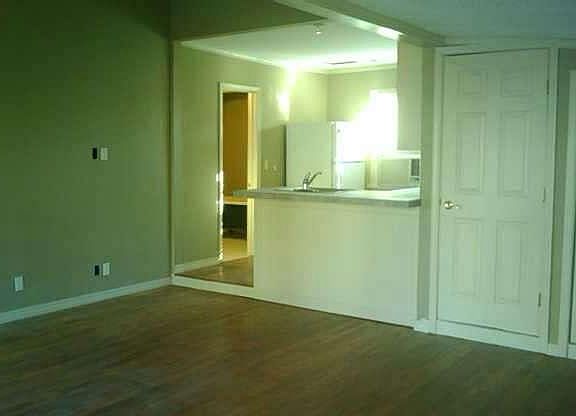 Living room view into open kitchen/eating bar
