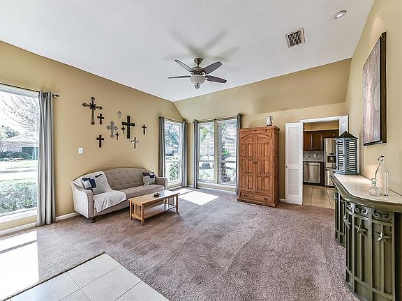 The front room is currently used as a formal living room, but this could also be used as formal dining area. Note the tall ceilings and the room has great natural light.