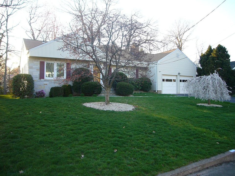 Amazingly manicured grounds surround this deceptively large home..