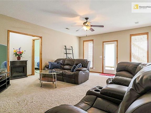 Lower Level Family Room with lots of windows, high ceilings and walks out to back yard.