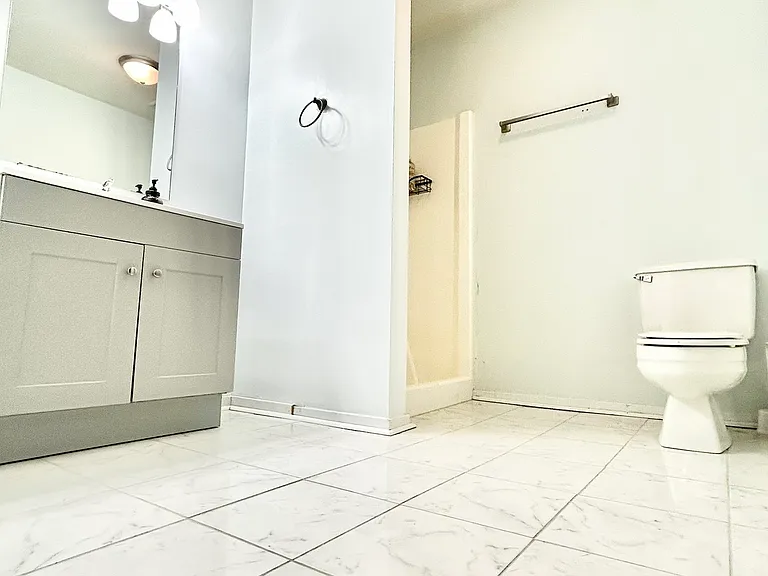 Guest Bathroom with New Tile Flooring and Vanity