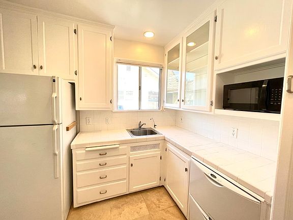 Kitchen shwing Dish Washer/Refrigerator etc.