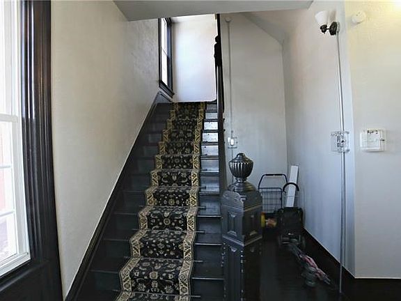 ANOTHER VIEW OF ENTRYWAY - LOOKING UPWARD FROM ENTRY TOWARD SECOND FLOOR UNIT.