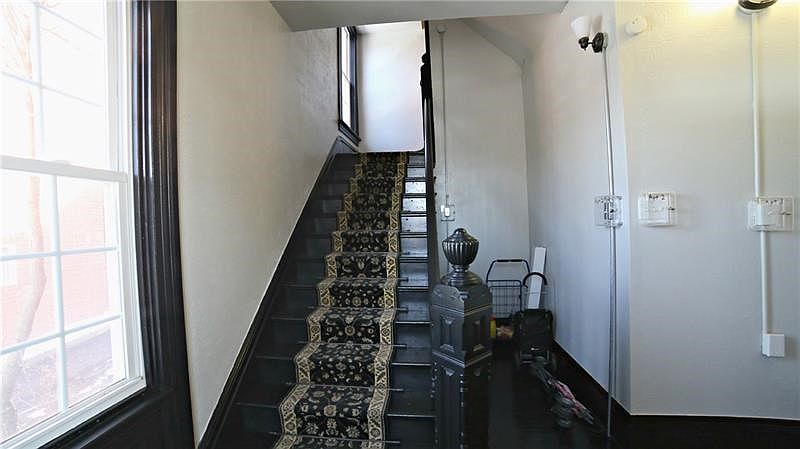 ANOTHER VIEW OF ENTRYWAY - LOOKING UPWARD FROM ENTRY TOWARD SECOND FLOOR UNIT.