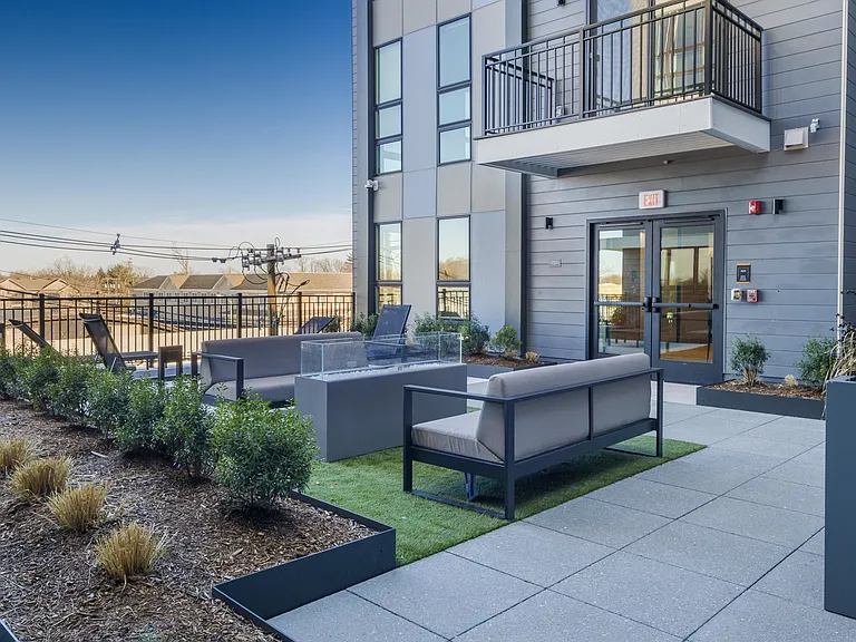 Breathe in some fresh air and relax in the outdoor fireplace lounge