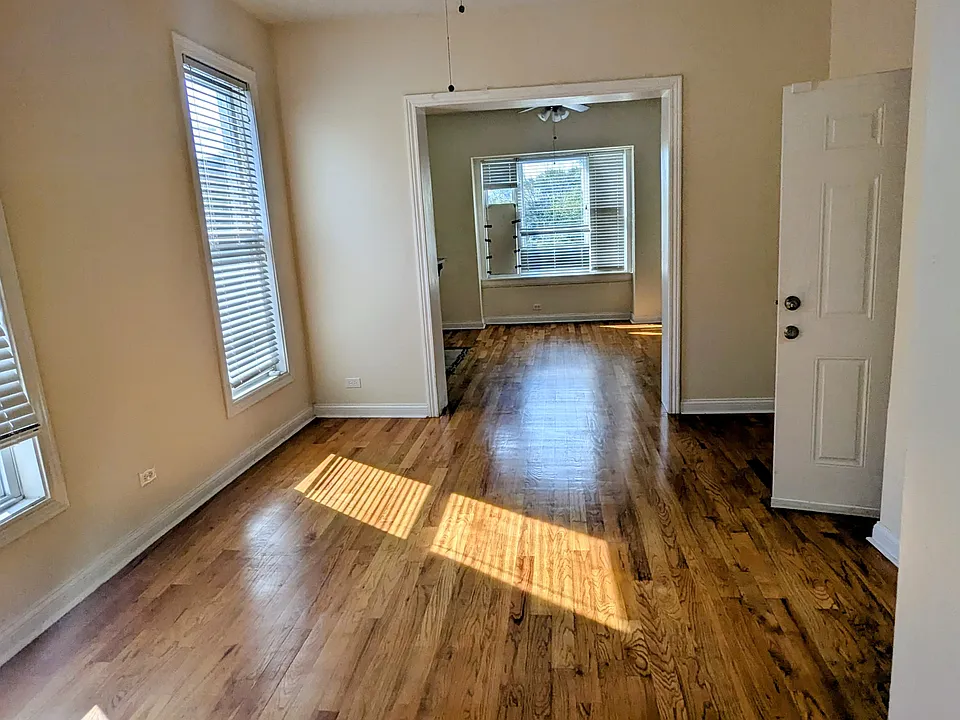 Living and dining room area with southern exposure and lots of natural light.
