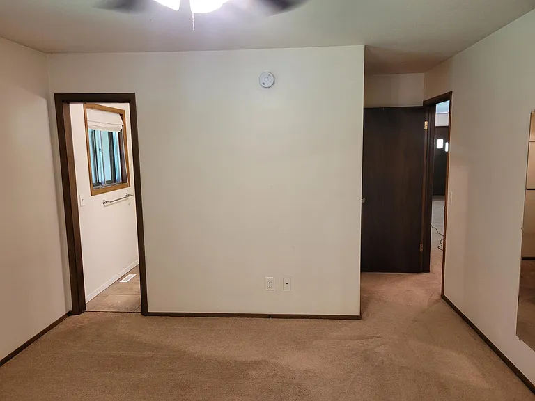 Inside master bedroom look toward front room and master shower/bathroom