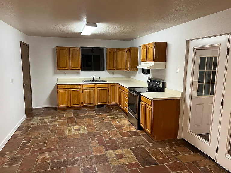 Downstairs kitchen. There is no refrigerator in this kitchen