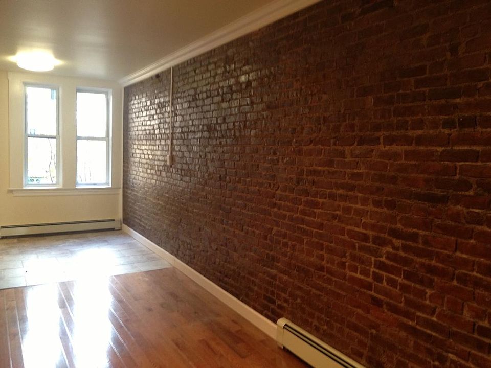Expsed brick in living room and kit