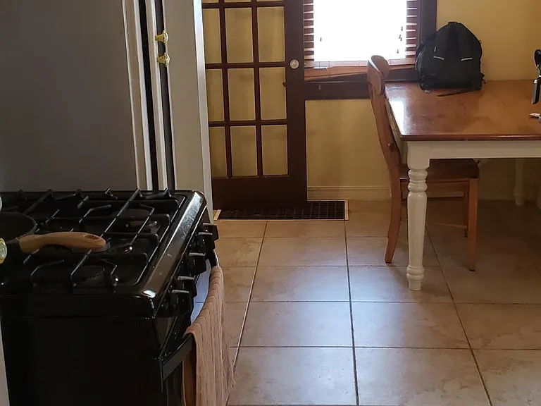 Kitchen, Range & nook table with north facing window, French style door leads to formal dining area