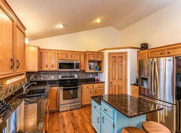 You'll love spending time in this updated, elegant kitchen complete with granite countertops, stainless steel appliances, tile backsplash, lots of cabinet space and an impressive pantry.
