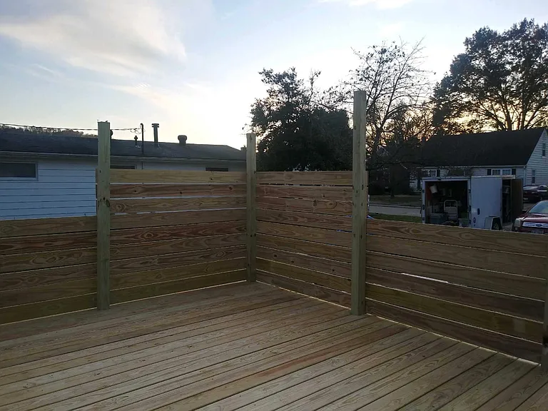 New 12' by 12' deck off side entrance and adjacent to yard.
