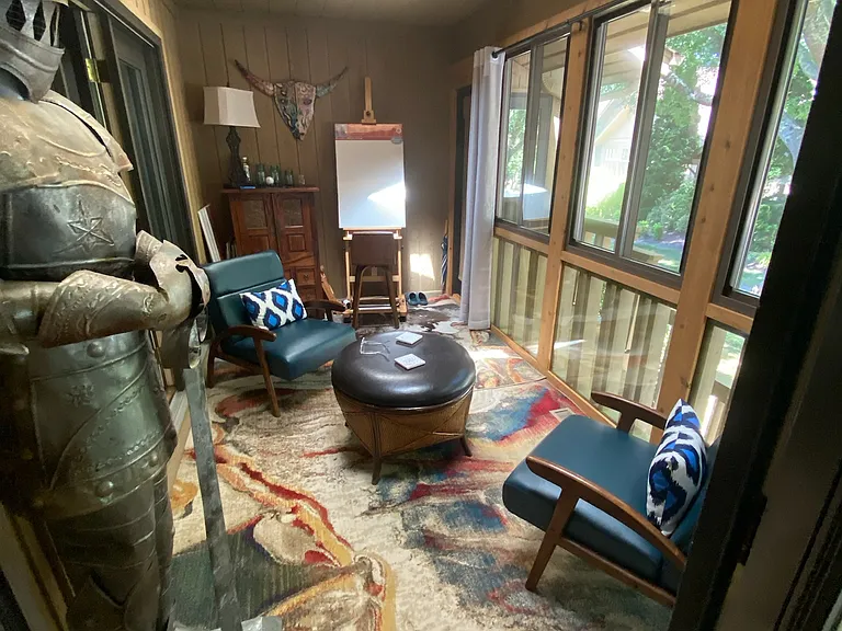 Cozy 4 season room off master bedroom and LR. Steps to the back of lot and access to basement for crafts and storage.