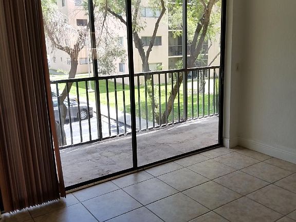 BALCONY FACES ONE OF TWO PERSONAL PARKING SPACES