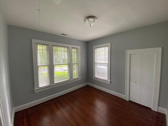 Front bedroom and closet. Beautiful heart pine floors!