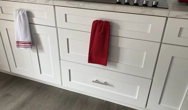 Kitchen includes storage cabinets and practical drawers