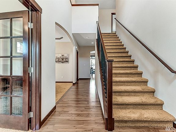 Notice the beautiful trim and welcoming front entrance.  Den/additional bedroom just to right of entrance. 