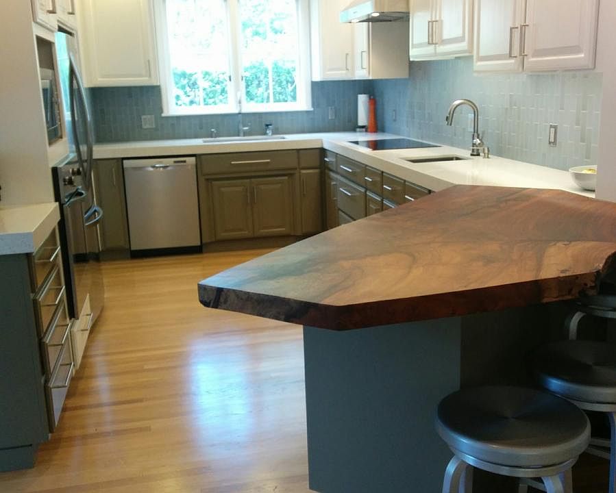 Newly renovated chef's kitchen with walnut breakfast bar