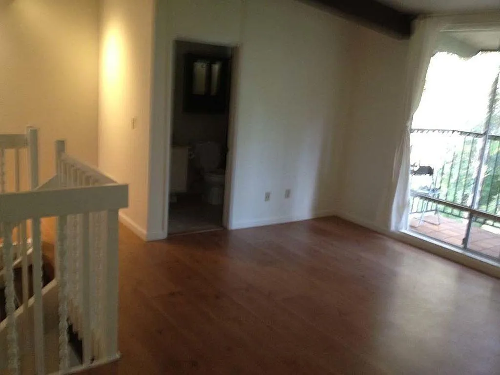 1st floor left section with bathroom & shower. May be converted to a bedroom or office or playroom.