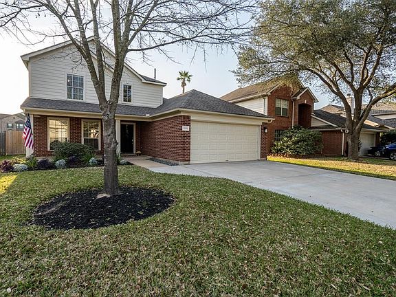 This home is located in an established neighborhood with mature trees and pretty foliage!