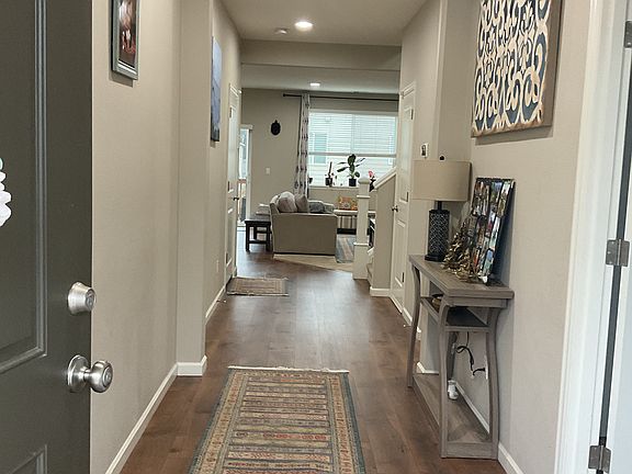 Bright hallway when you open the front door with office space on the right side of the hallway
