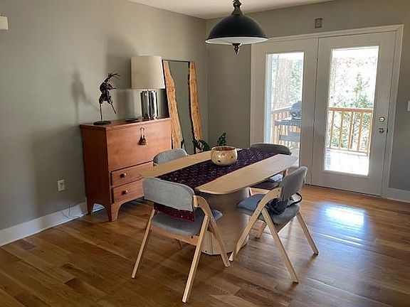 Dining room with double doors to covered back porch