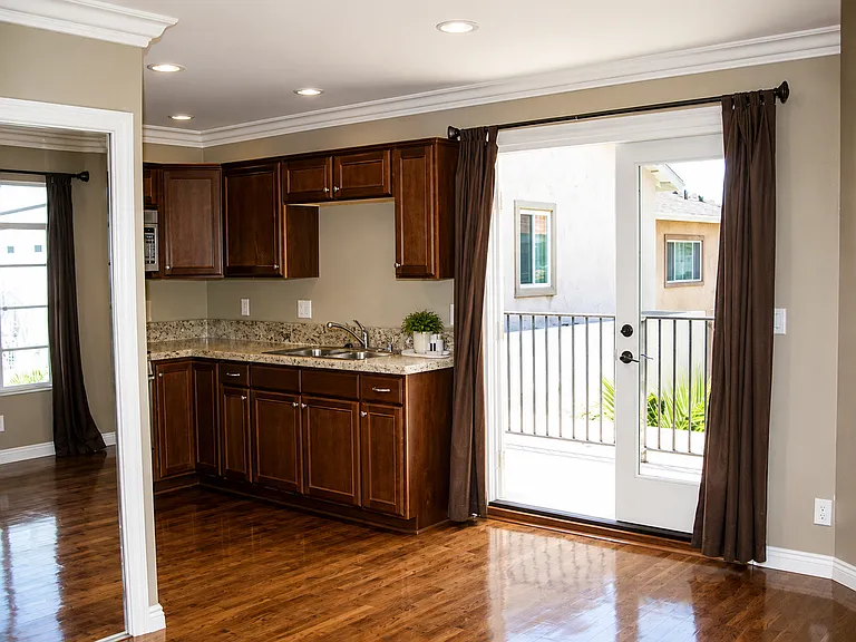 Kitchen features gas oven and stove, refrigerator freezer, microwave, double sink with garbage disposal.