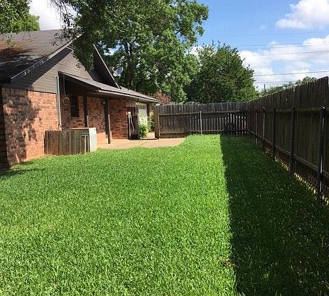 Side yard with another patio