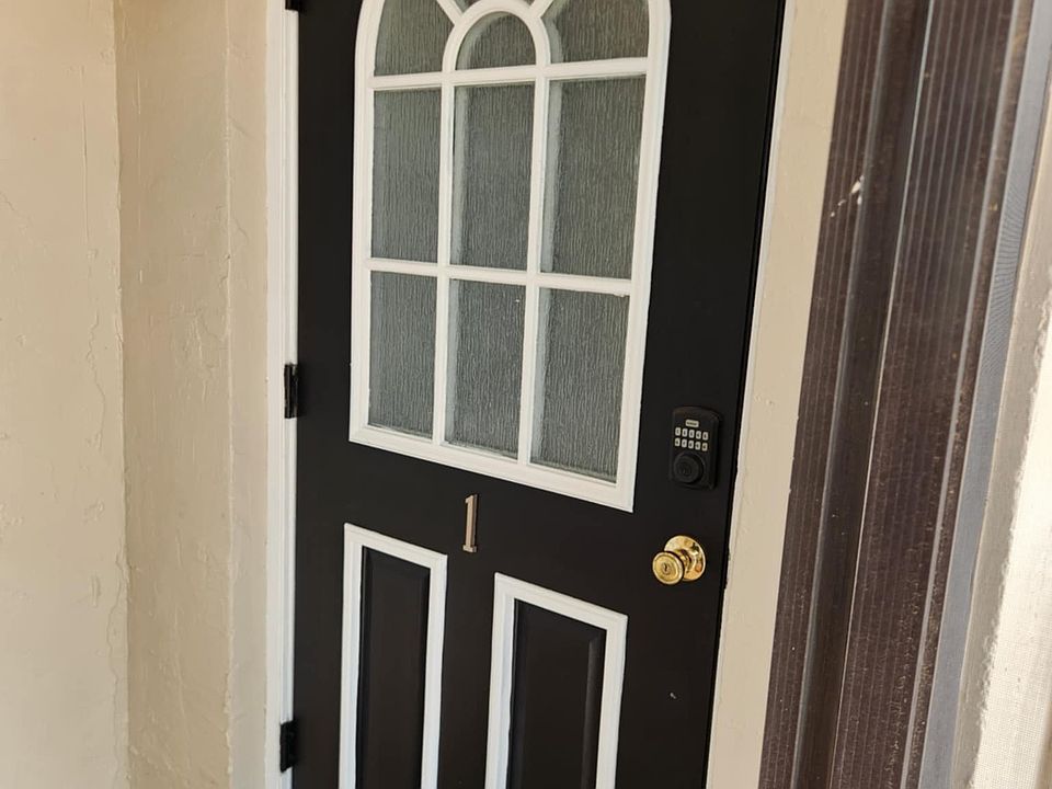 Front door with private screen area.