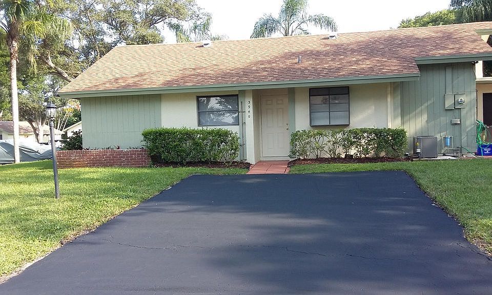 Private home corner lot with screened in sunroom.