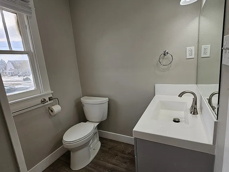 New bathroom with quartz countertops and tons of built-in storage.