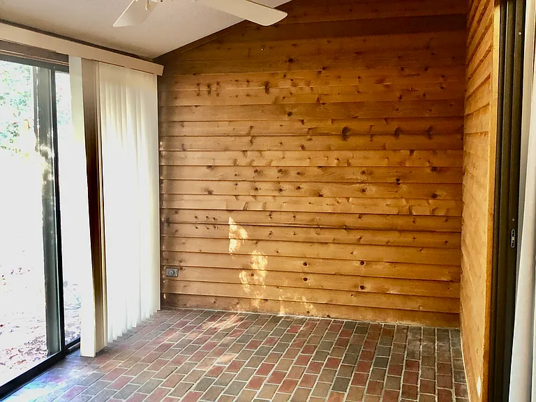 Enclosed sunroom can be utilized 365 days a year! There are glass doors between the great room and the sunroom. This would also be a great space for an office or an extra space for toys and stuff.