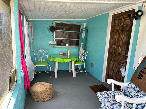 Screened patio outside main bedroom