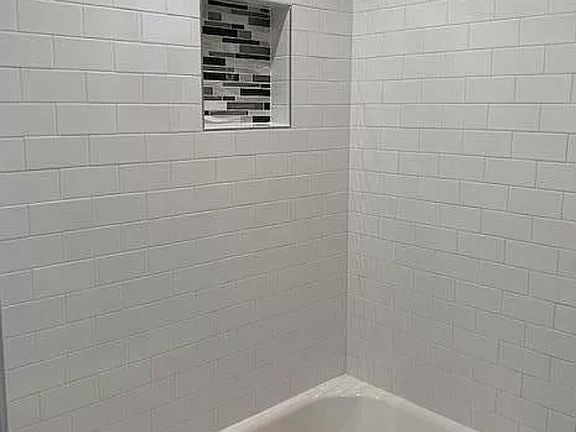 Master bathroom shower and tub.