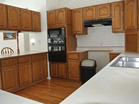 NICE WOODWORK IN THE OPEN KITCHEN