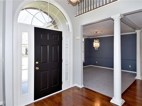 A beautiful arched doorway introduces this lovely interior that has been freshly painted.
