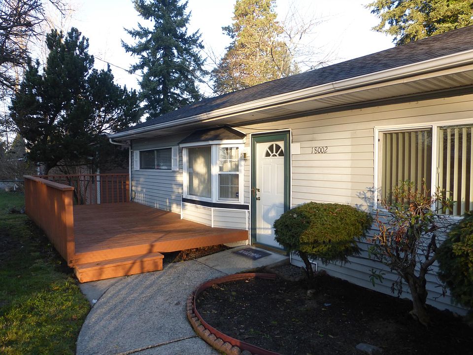 Front of home with large deck.