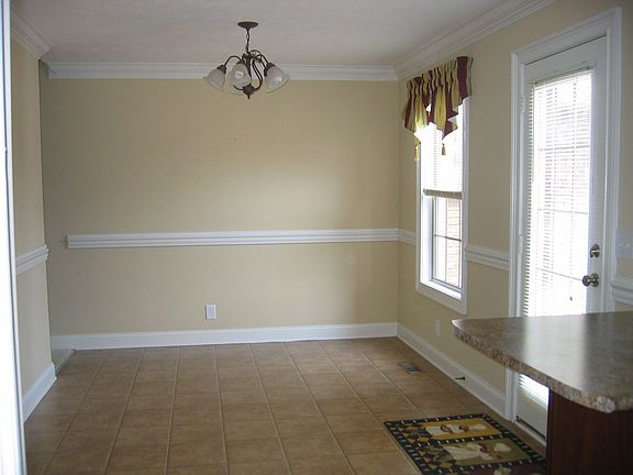 Dining Area with Chair Rail & Door to the Deck
