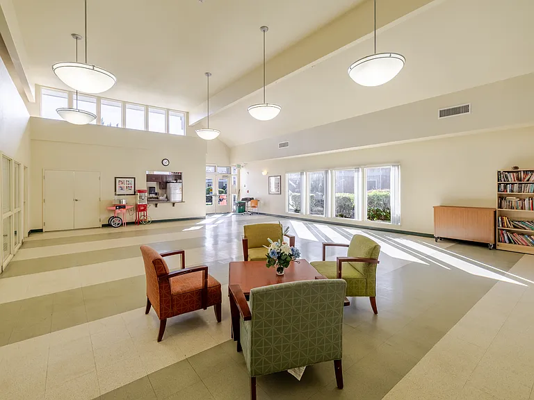 The community room features a resident library for quiet reading, study sessions, or casual browsing.
