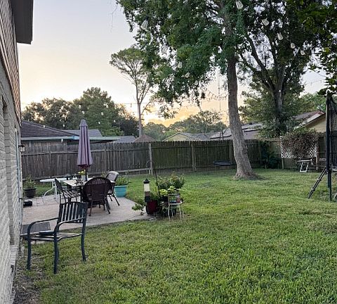 Large back yard with great trees and family space.